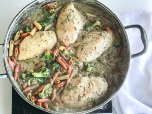 chicken, broccoli, penne pasta noodles in a roux