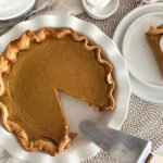 Grandma Miller's Pumpkin Pie with a slice cut out
