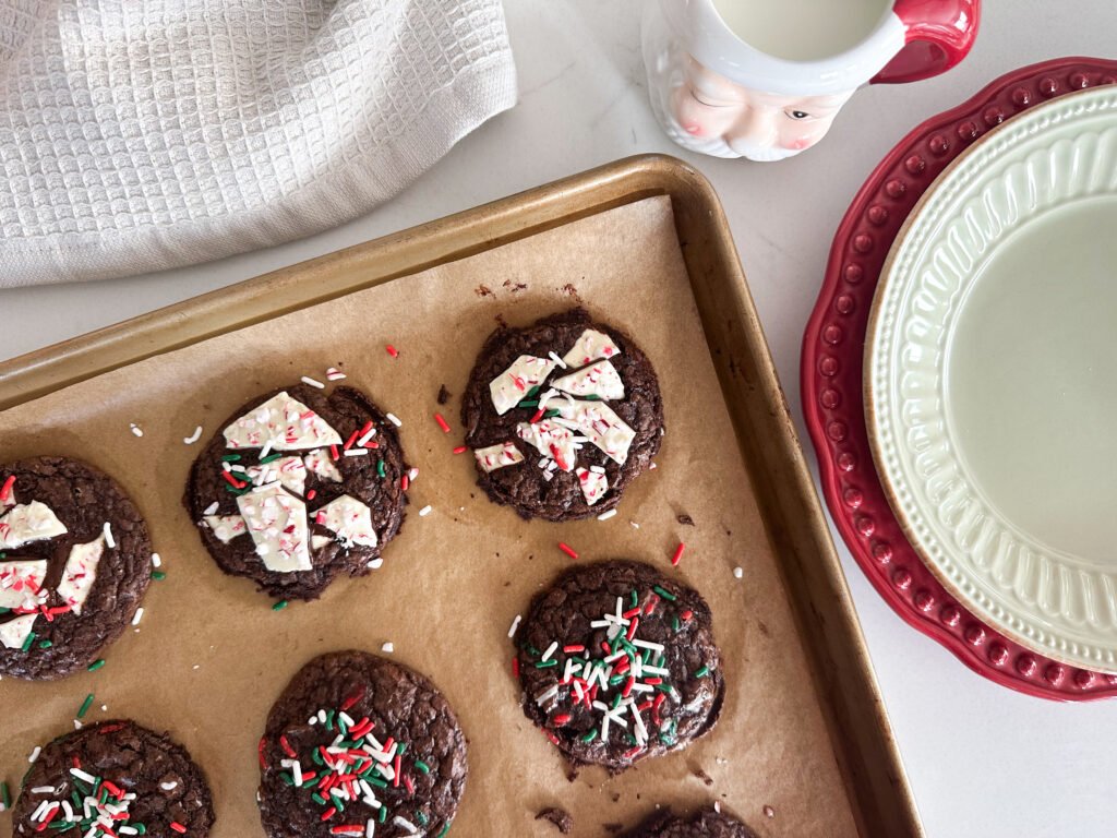 Boxed Brownie Holiday Cookies with a Santa mug of cold milk