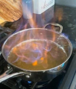 Bourbon Cinnamon Scalloped Sweet Potatoes - flambé