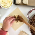 Philly cheesesteak egg rolls - process - filling the wrap