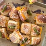 ham and cheese sliders on a sheet pan.