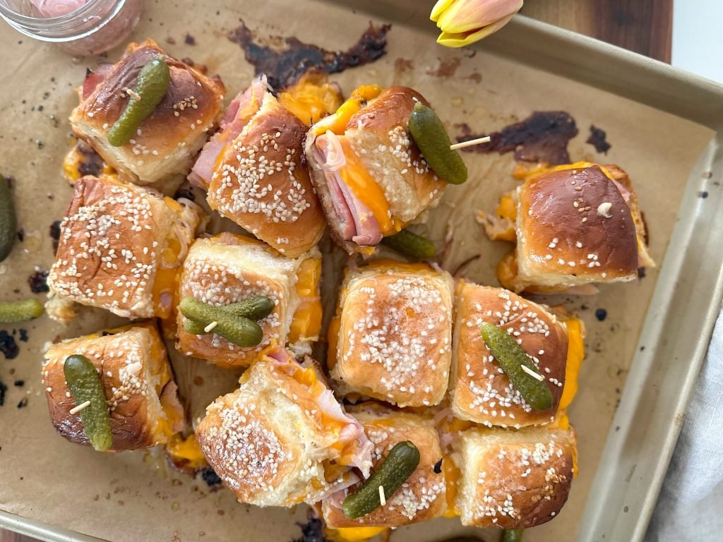 ham and cheese sliders on a sheet pan.