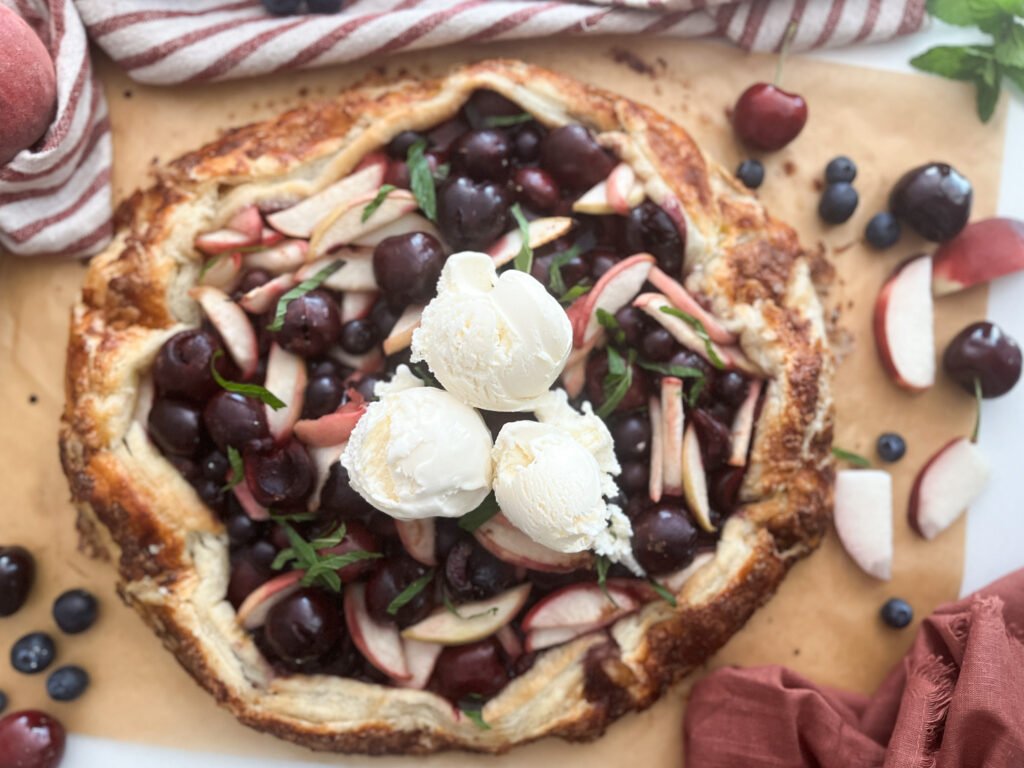 Easy Summer Three-Fruit Galette with scoops of ice cream