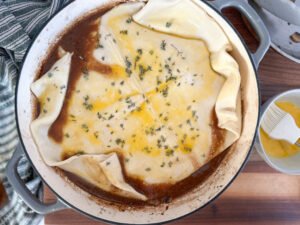 Beef Wellington pot pie with egg washed puff pastry