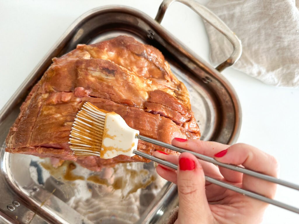 Adding a brown sugar glaze to a holiday ham