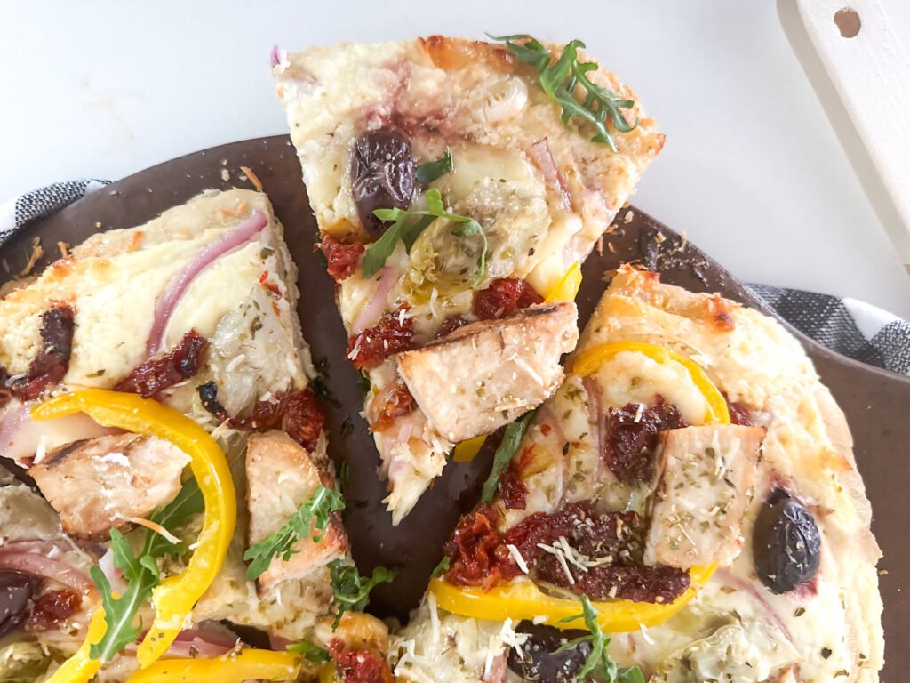 A slice of Zesty Greek Chicken Pizza 