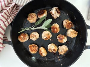 Easy Herby Turkey Meatballs browning in a pan