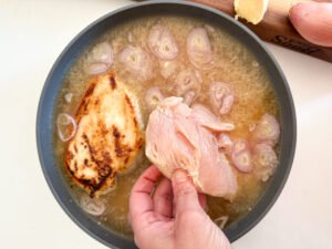 Add the top-browned chicken into the prepared ginger garlic rice mixture.
