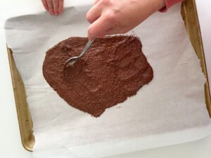 Spreading out the popped quinoa chocolate bark