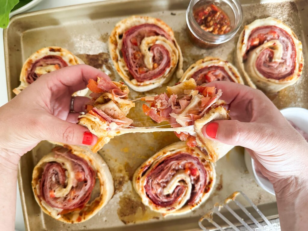 Hot Italian Hoagie Pinwheels, cheese pull 