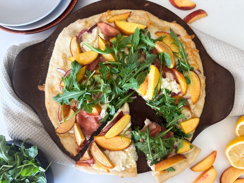 Slices of peach prosciutto pizza 