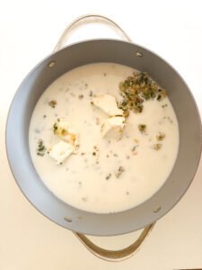 Milk and cream cheese added to create a white sauce.