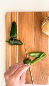 How to cut a jalapeño pepper - first step, hold the stem upright