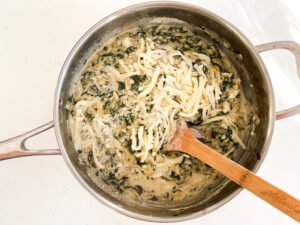 Adding in the cheese.